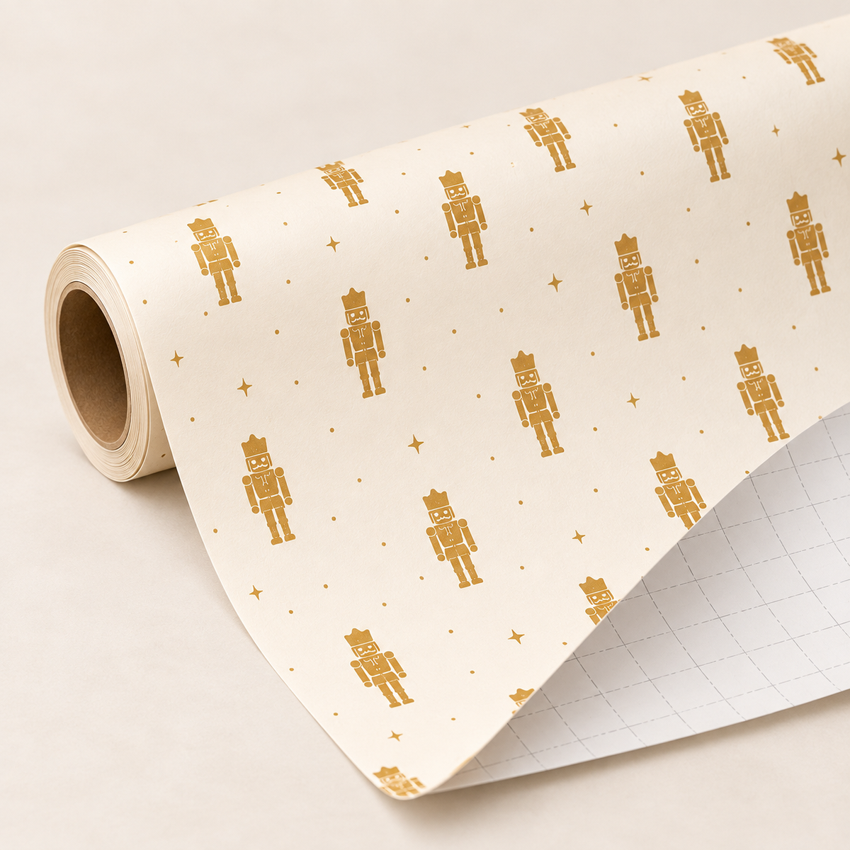 Maison Velere Ivory and Gold Nutcracker wrapping paper roll showing light gray cutting grid lines on the back