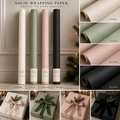 Maison Velere solid wrapping paper in ivory, sage, blush and black with coordinating wrapped gifts